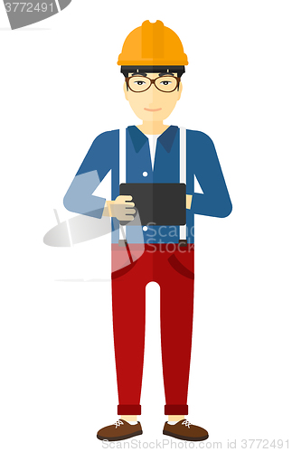 Image of Man holding tablet computer.