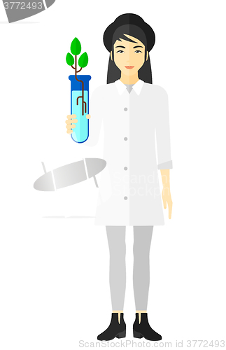 Image of Laboratory assistant with test tube.