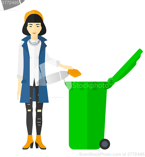 Image of Woman throwing trash.