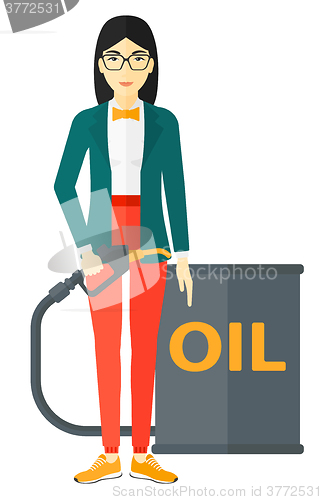 Image of Woman with oil can and filling nozzle.