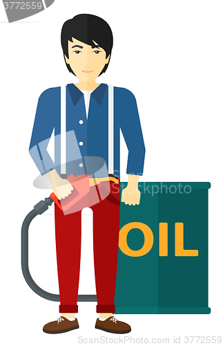 Image of Man with oil can and filling nozzle.