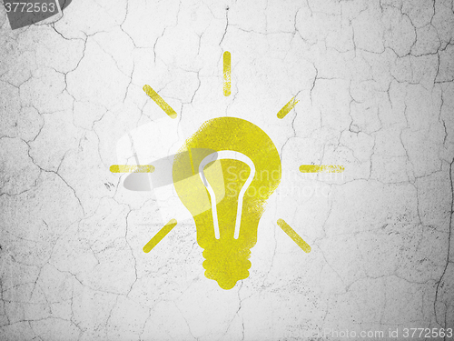 Image of Finance concept: Light Bulb on wall background