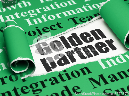 Image of Business concept: black text Golden Partner under the piece of  torn paper