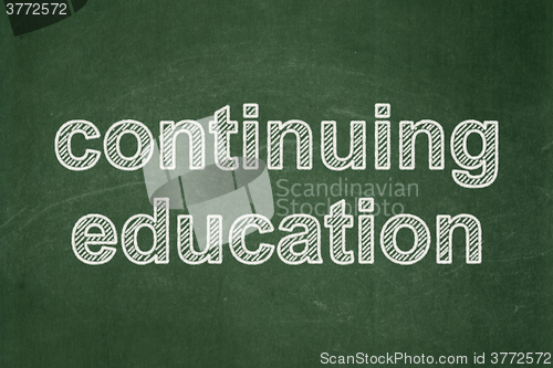 Image of Education concept: Continuing Education on chalkboard background