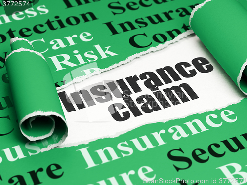 Image of Insurance concept: black text Insurance Claim under the piece of  torn paper