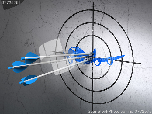 Image of Vacation concept: arrows in Airplane target on wall background