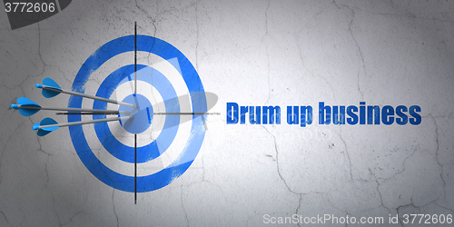 Image of Finance concept: target and Drum up business on wall background