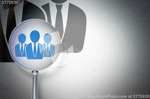 Image of Advertising concept:  Business People with optical glass on digital background