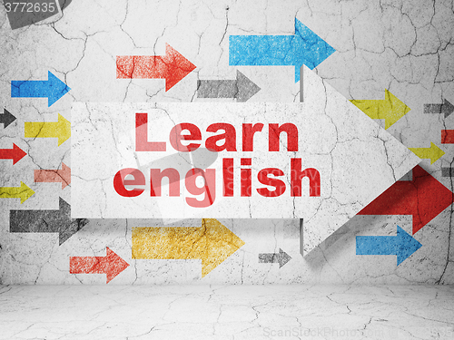 Image of Education concept: arrow with Learn English on grunge wall background