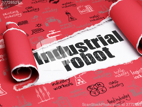 Image of Industry concept: black text Industrial Robot under the piece of  torn paper