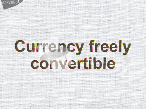 Image of Currency concept: Currency freely Convertible on fabric texture background