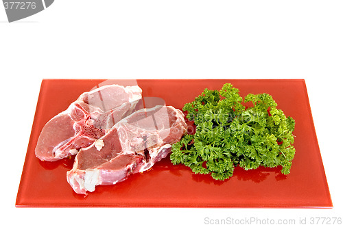 Image of Lamb chops on red plate