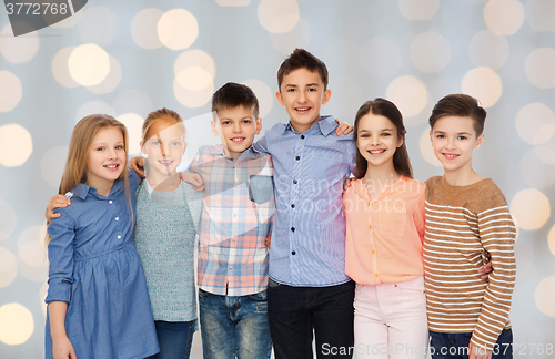 Image of happy smiling children hugging