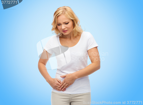 Image of unhappy woman suffering from stomach ache