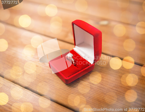 Image of close up of gift box with diamond engagement ring