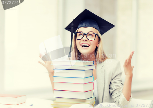 Image of happy student in graduation cap