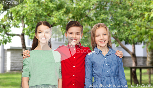 Image of happy boy and girls hugging over backyard