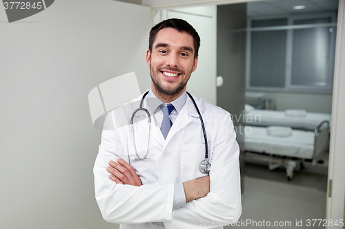Image of smiling doctor with stethoscope at hospital 