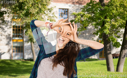 Image of happy student girl making face and having fun