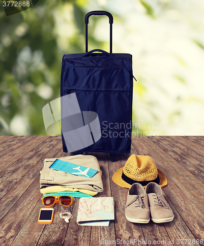 Image of travel bag and personal stuff for vacation