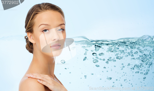 Image of smiling young woman face and shoulders