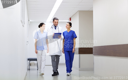 Image of group of medics at hospital with clipboard