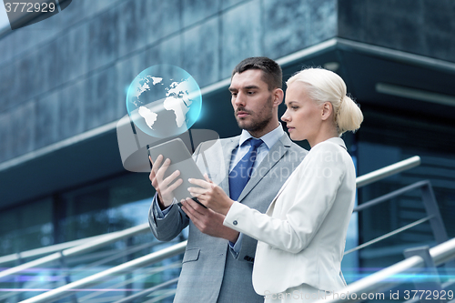 Image of businesspeople with tablet pc outdoors