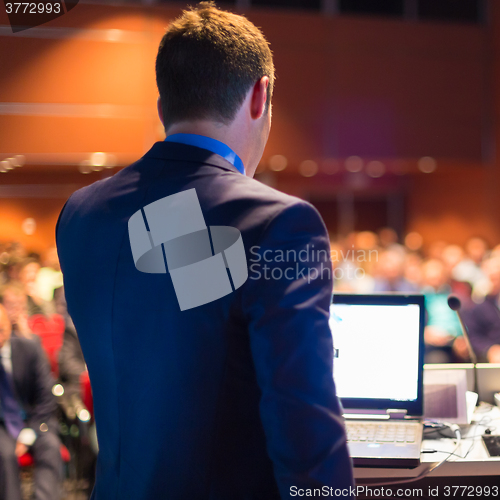 Image of Public speaker at Business Conference.