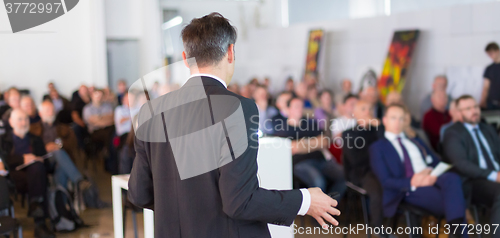 Image of Speaker at Business Conference and Presentation.