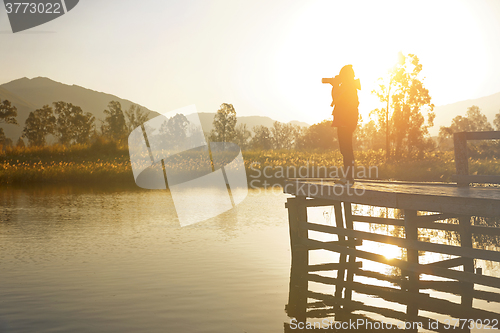 Image of Young photographer is taking photos