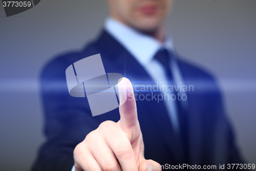 Image of business, technology, internet and networking concept - businessman pressing button with contact on virtual screens. 