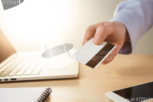 Image of The man doing online shopping with credit card 