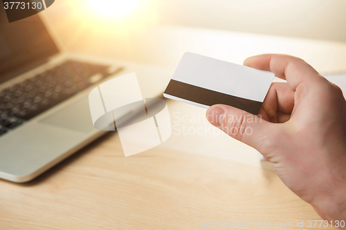 Image of The man doing online shopping with credit card 