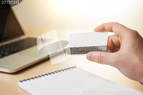 Image of The man doing online shopping with credit card 