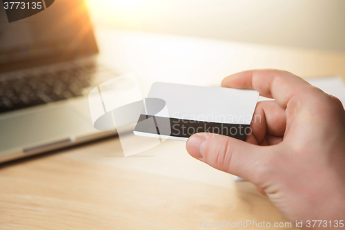 Image of The man doing online shopping with credit card 