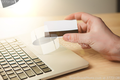 Image of The man doing online shopping with credit card 