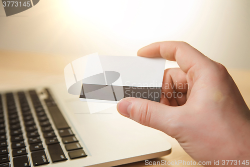 Image of The man doing online shopping with credit card 