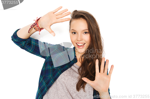 Image of happy smiling pretty teenage girl showing hands