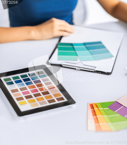 Image of woman working with color samples for selection