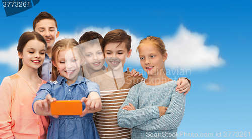 Image of happy children talking selfie by smartphone