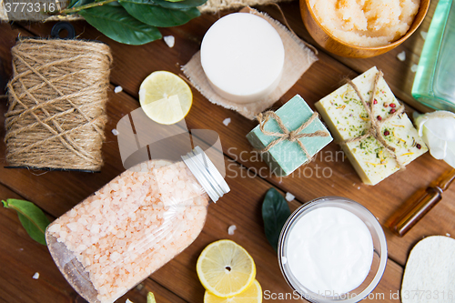 Image of close up of body care cosmetic products on wood