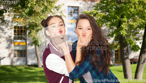 Image of happy smiling teenage student girls having fun