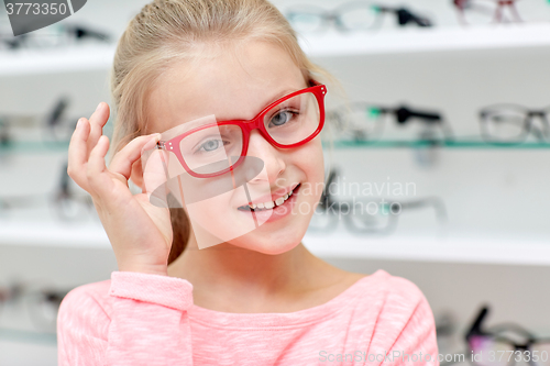 Image of little girl in glasses at optics store