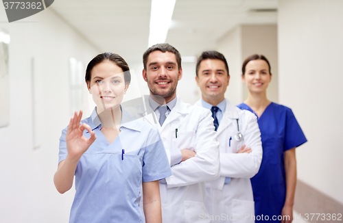 Image of group of happy medics or doctors at hospital