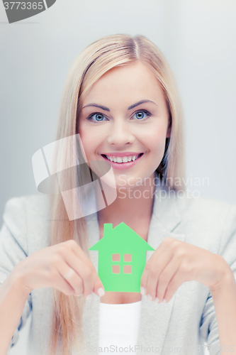 Image of woman with illustration of eco house