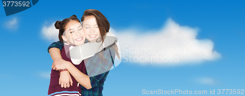 Image of happy smiling pretty teenage girls hugging