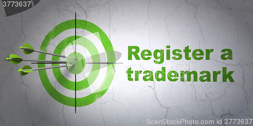 Image of Law concept: target and Register A Trademark on wall background