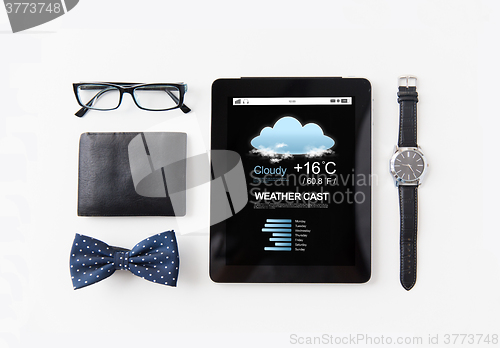 Image of tablet pc with weather cast and personal stuff