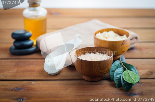 Image of close up of salt, massage oil and bath stuff