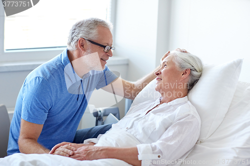Image of senior couple meeting at hospital ward